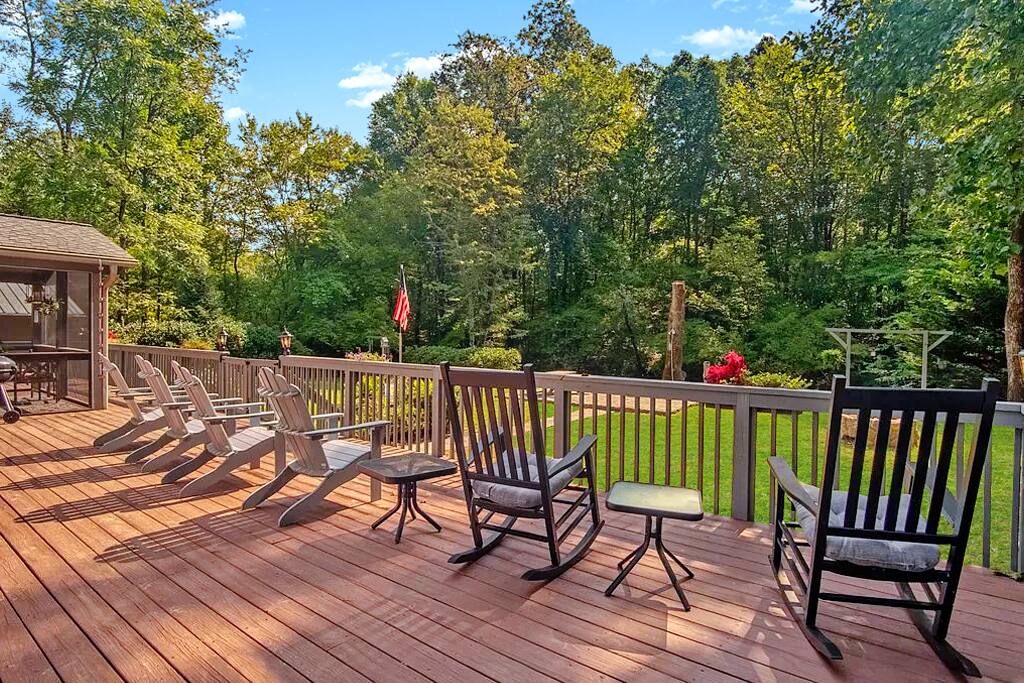 The back deck is very large. It spans the entire width of the house and has plenty of seating. Access the deck from numerous areas of the house. Enjoy dining al fresco in the scree